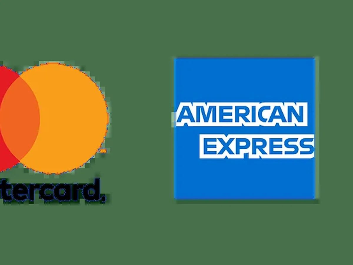Man reviewing IPTV subscription cost breakdown on laptop and smart TV